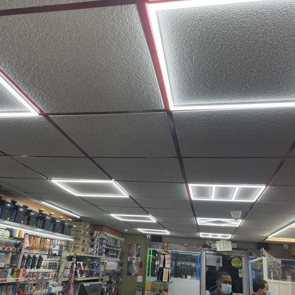 Square LED ceiling light installation in modern workshop