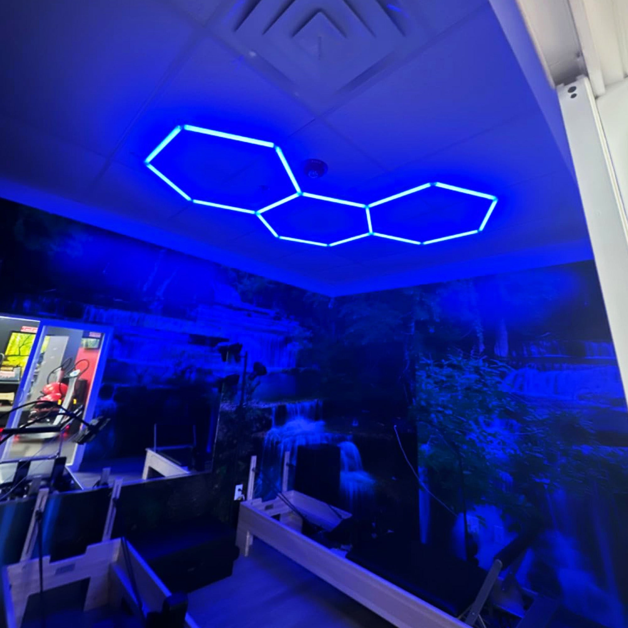 RGB hexagon wall lights framing a product display