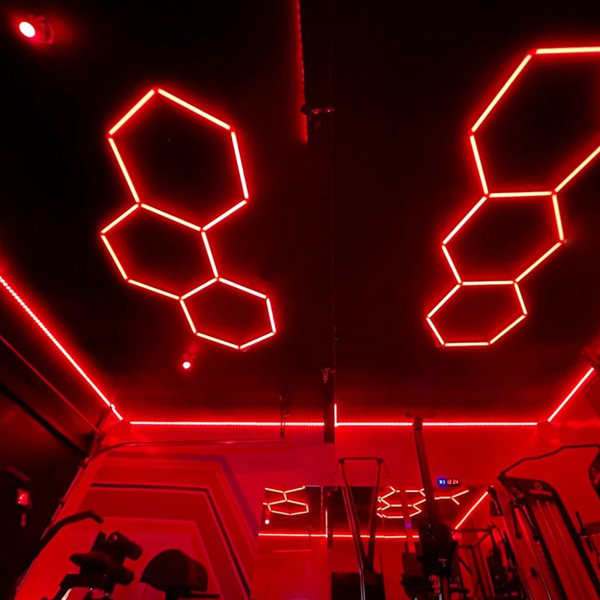 RGB Hexagon Ceiling Lights illuminating an automotive showcase