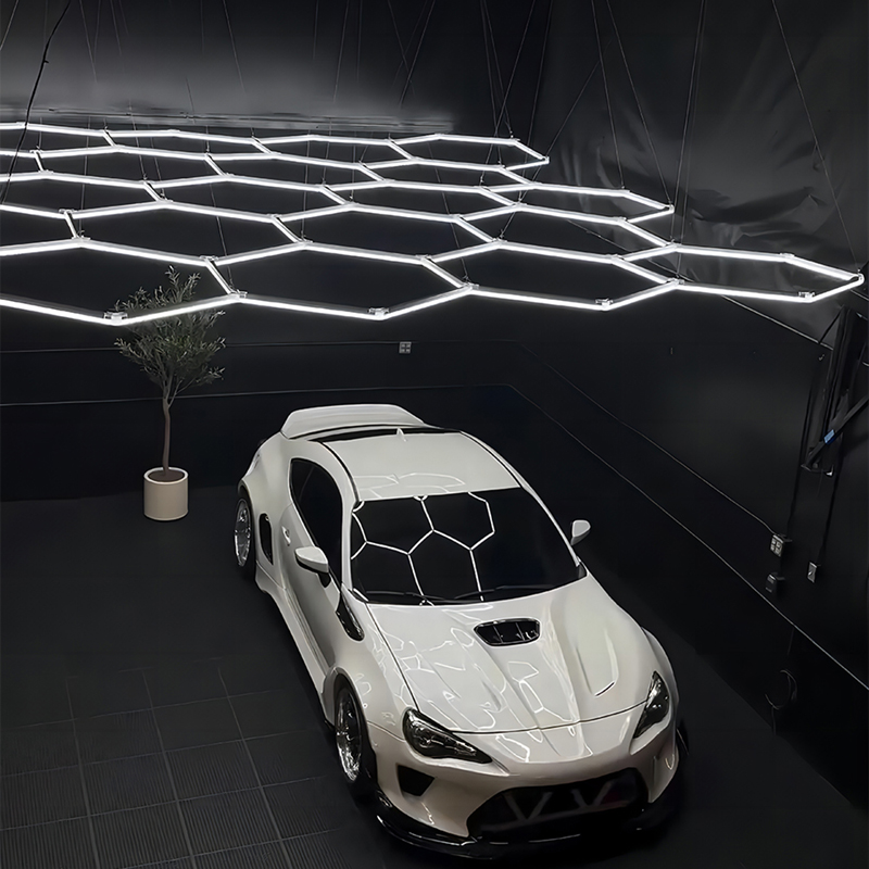 Hexagonal lighting grid installed in a premium auto detailing bay